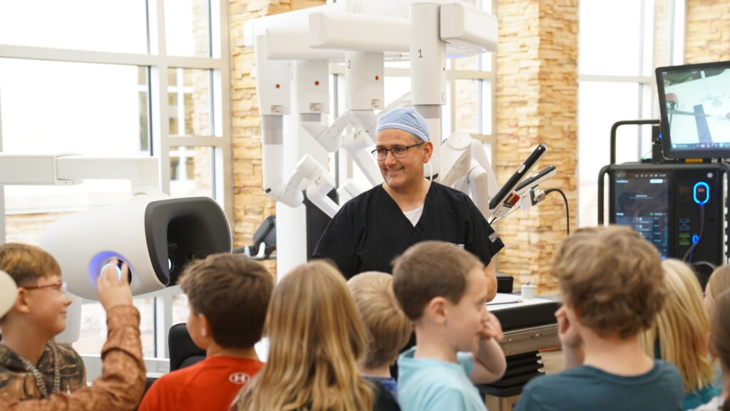 Dr. Morse with third grade students from Loma Elementary at the FHW robot naming ceremony.